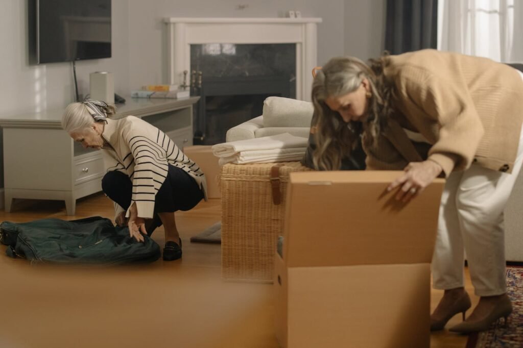 Senior moving expert providing personalized relocation assistance to an elderly client inside their North Vancouver home.
