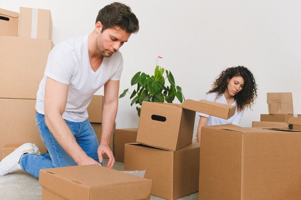 Professional team of senior moving specialists in North Vancouver standing in front of a moving truck, ready to assist with elderly relocation.